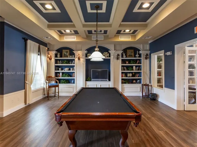 a front view of a residential apartment building with a yard