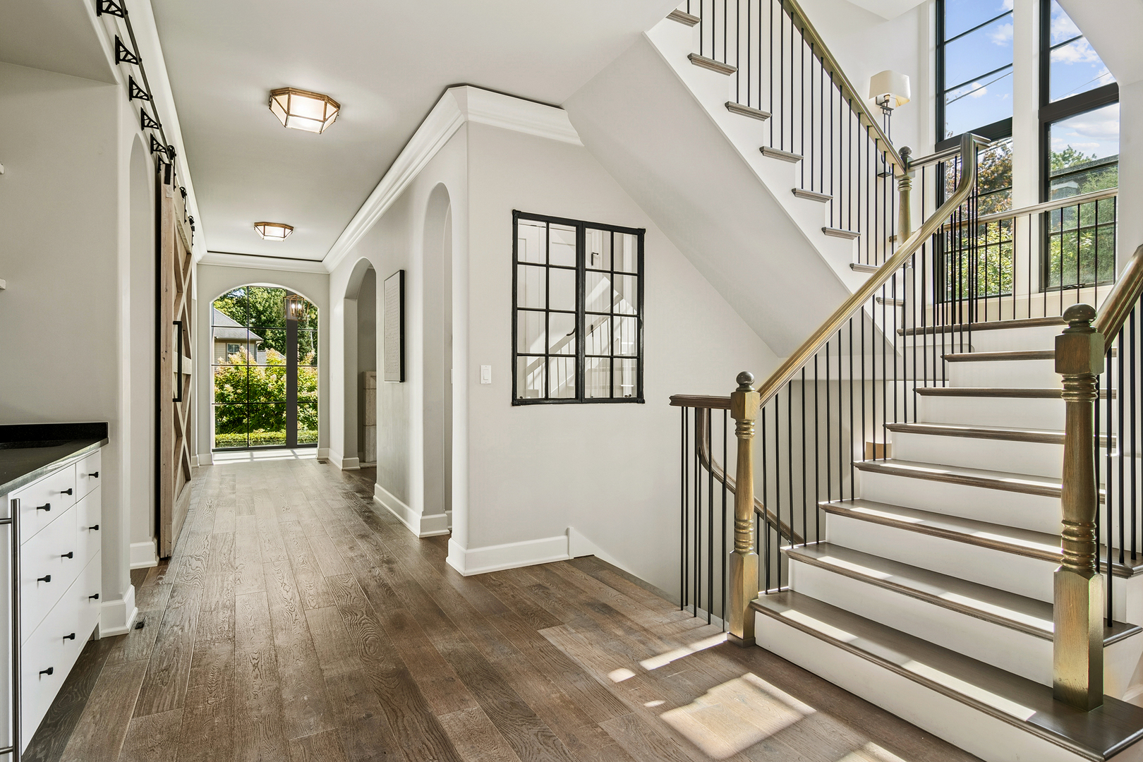 636 South Division Street Barrington, IL 60010 - Photo 13 of 61 a view of a hallway view with wooden floor and staircase