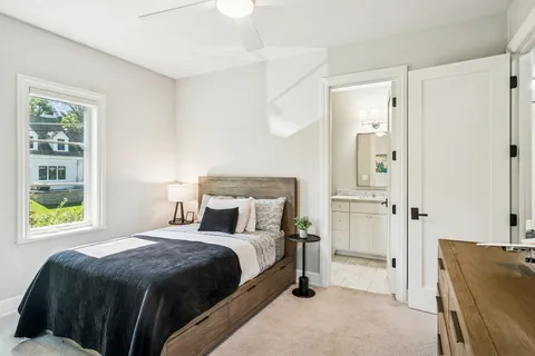 a view of a livingroom with furniture and a flat screen tv