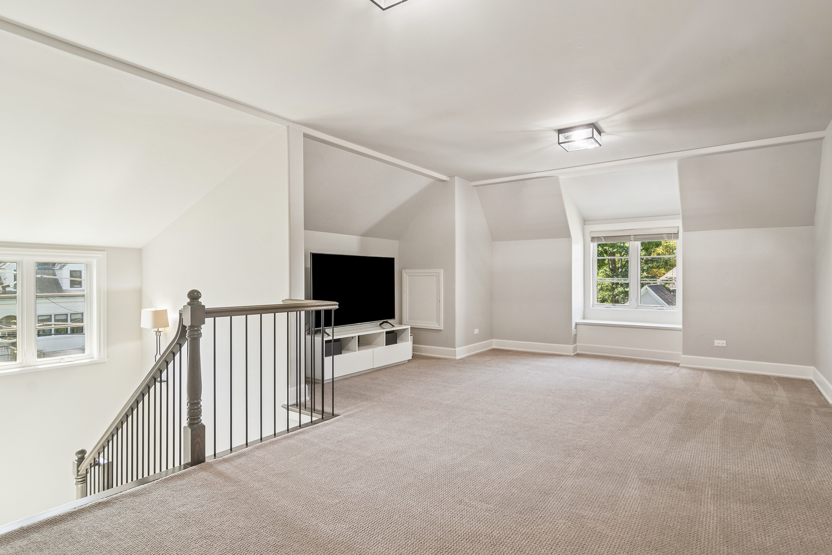 636 South Division Street Barrington, IL 60010 - Photo 43 of 61 a view of a livingroom with furniture and a flat screen tv