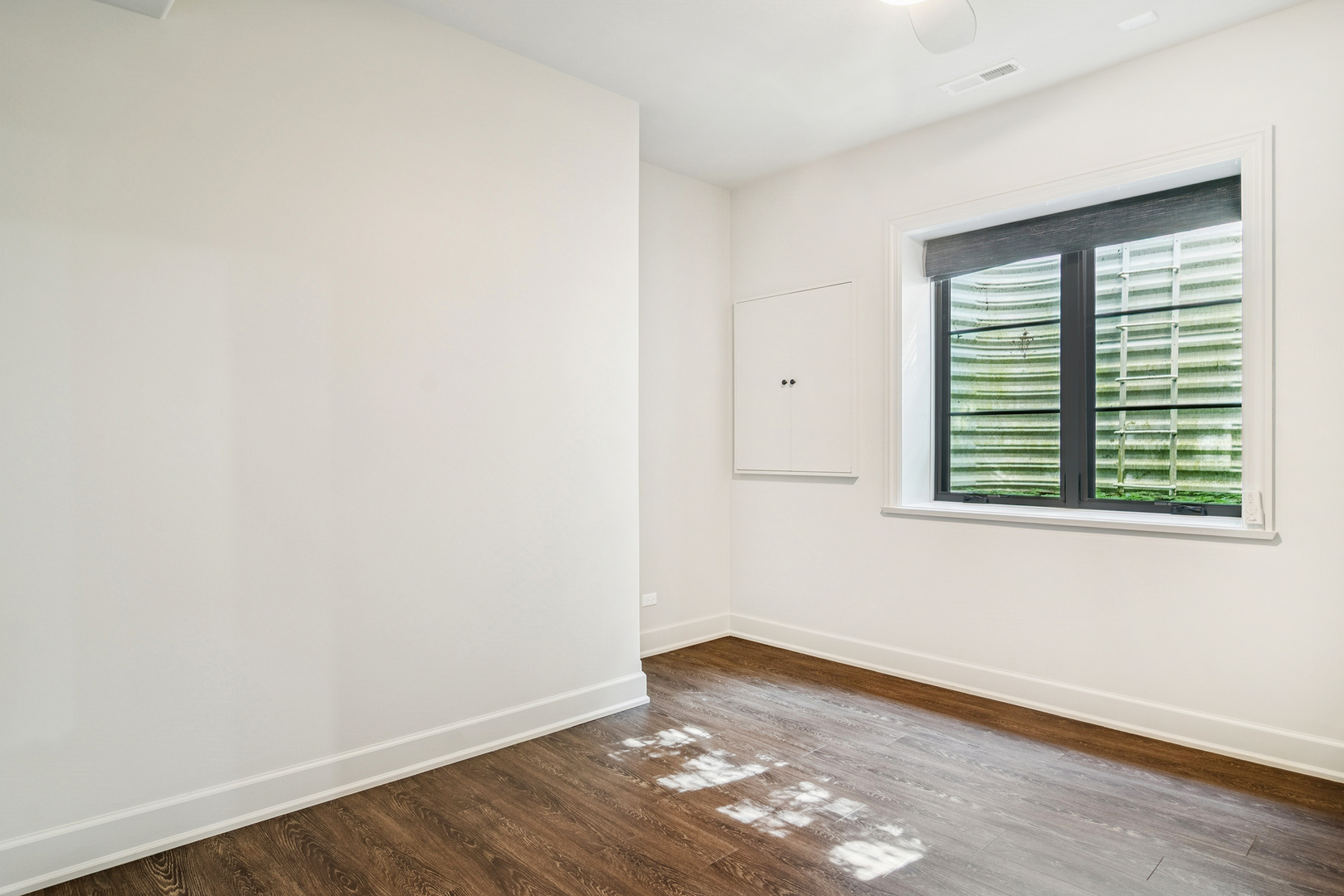 636 South Division Street Barrington, IL 60010 - Photo 52 of 61 an empty room with wooden floor and windows