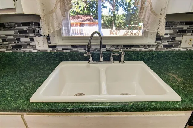 a view of a swimming pool with a yard