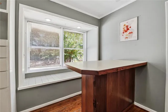 a room with a large window and a bed