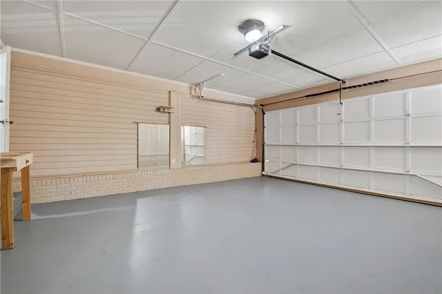 a view of a livingroom with an empty space and a ceiling fan