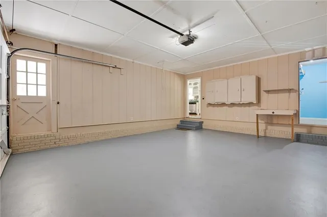 a view of a livingroom with furniture and natural light