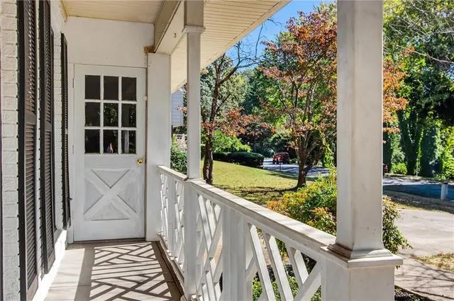 a view of a door and a window