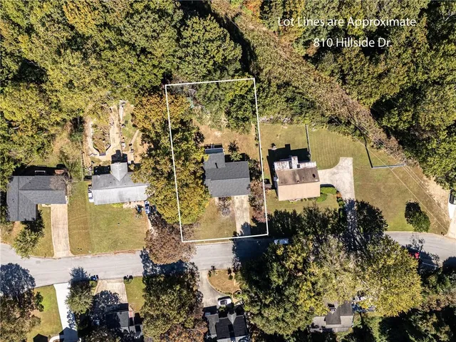 an aerial view of a houses with yard