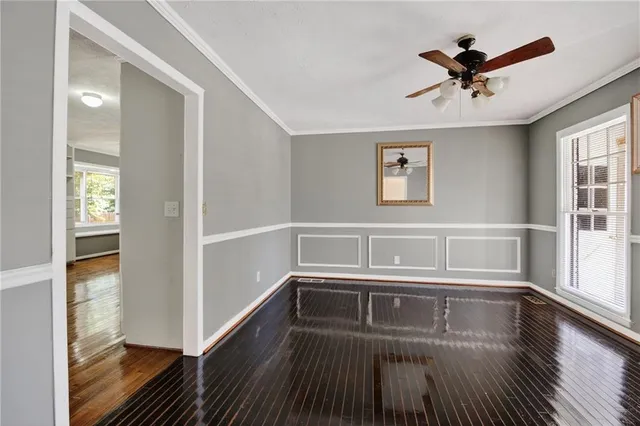 a view of livingroom with hardwood floor and a ceiling fan