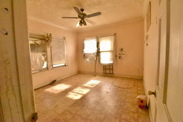 a view of an empty room and window