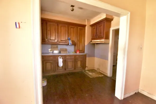 a kitchen with a sink and refrigerator