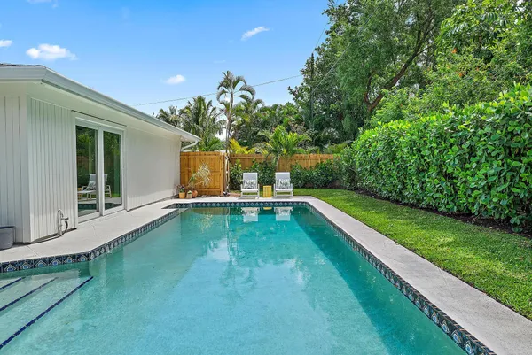 a view of a house with pool porch and furniture
