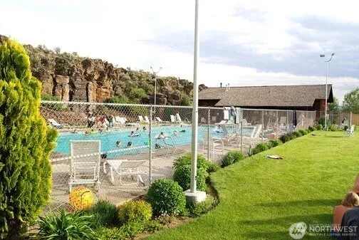 a view of a balcony with yard