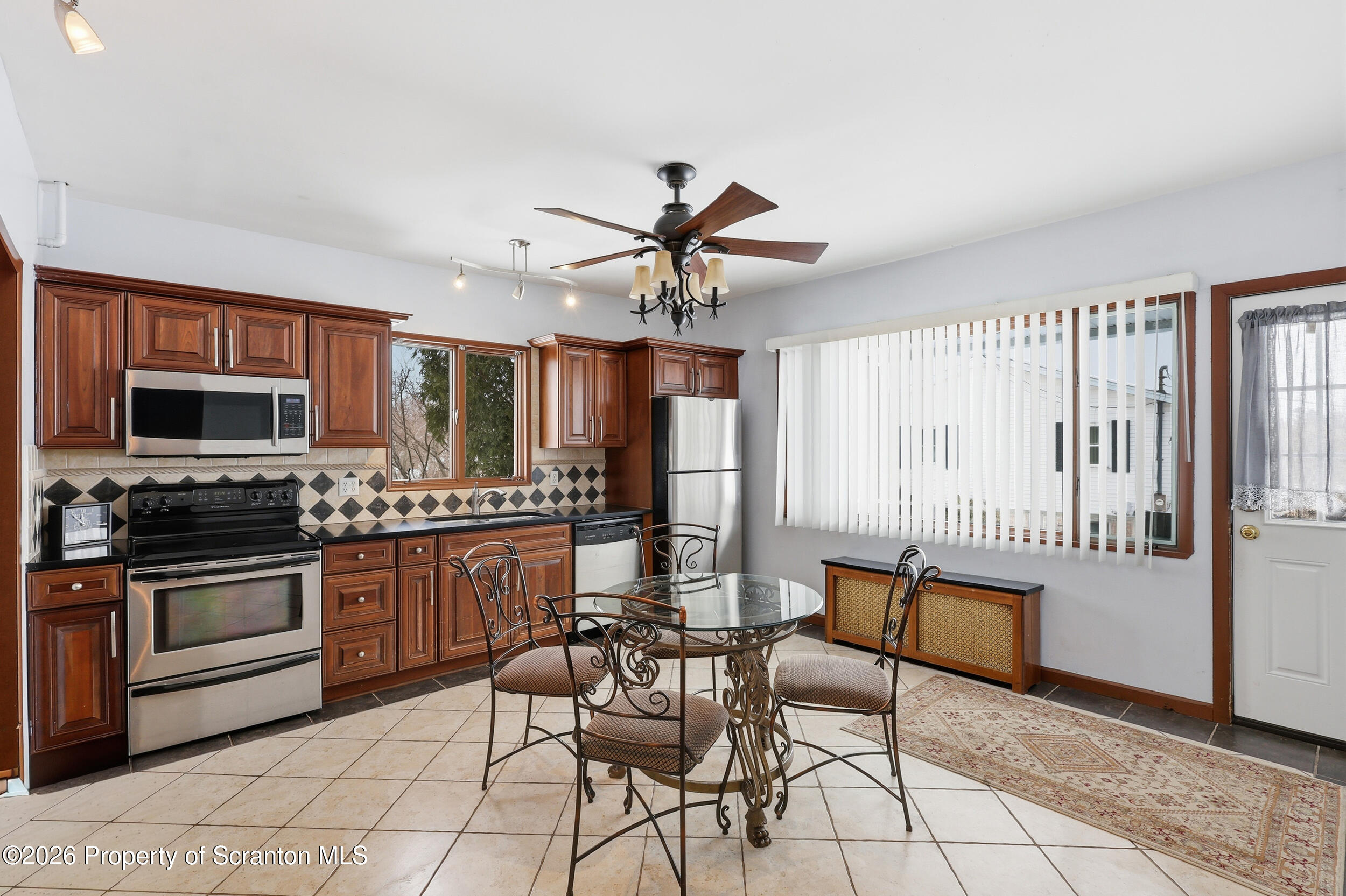 143 Old Boston Road Pittston, PA 18640 - Photo 38 of 61 a kitchen with stainless steel appliances kitchen island granite countertop a stove a sink and a refrigerator