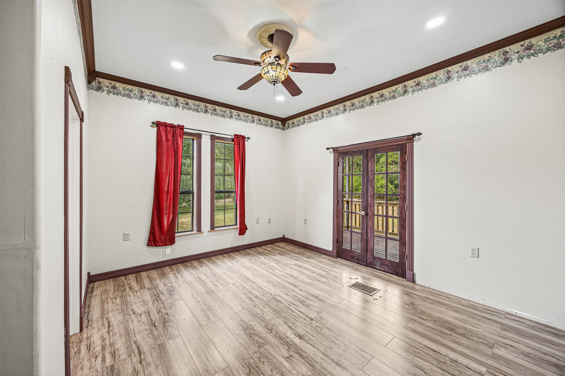 7 Northwood Country Road Huffman, TX 77336 - Photo 21 of 50 a view of an empty room with a window and a ceiling fan