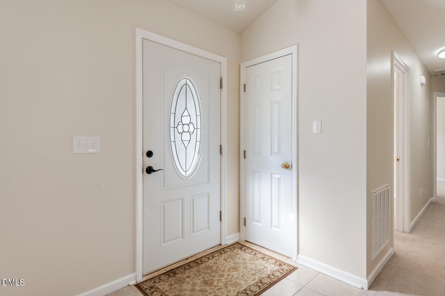 136 Pebblestone Court Willow Spring, NC 27592 - Photo 10 of 24 a view of front door with wooden floor