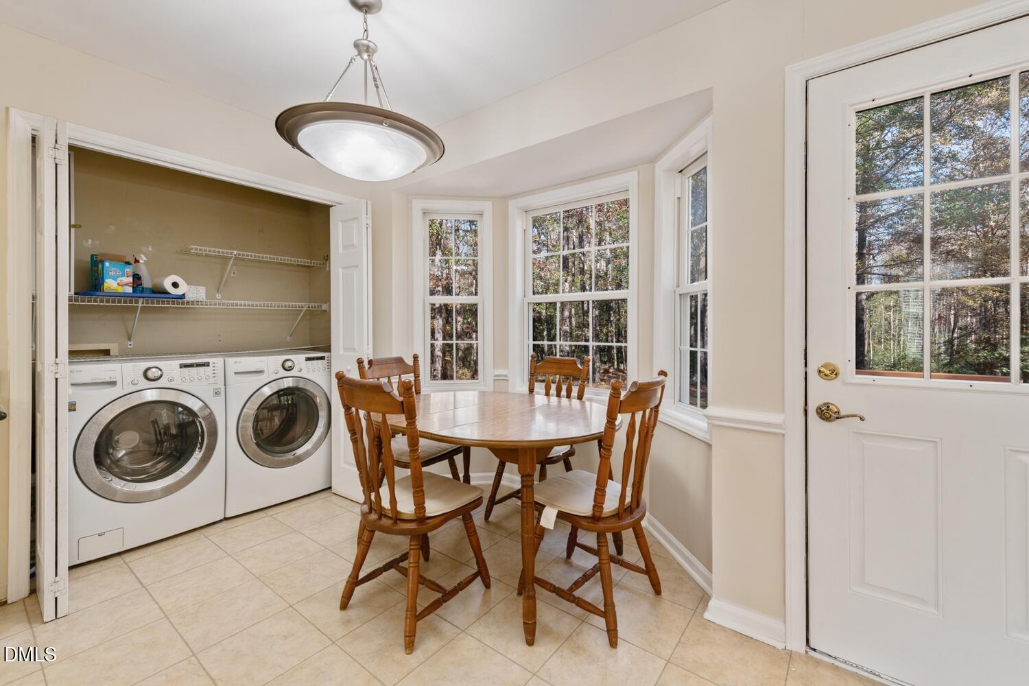 136 Pebblestone Court Willow Spring, NC 27592 - Photo 13 of 24 a view of a a dining room with furniture window and outside view