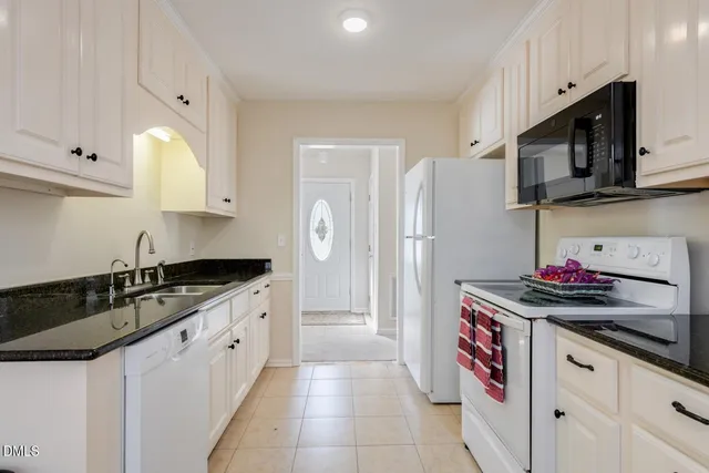 a view of a a dining room with furniture window and outside view