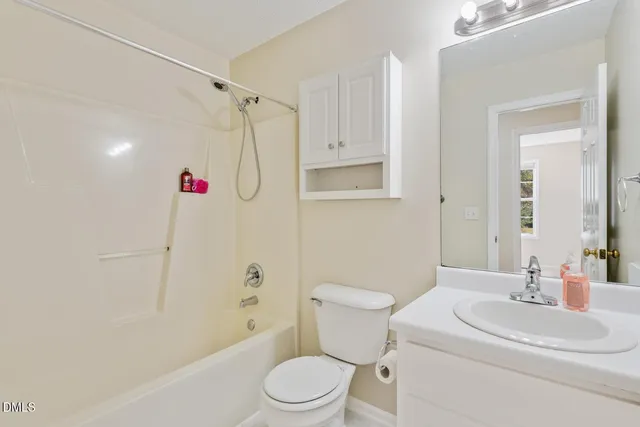 a kitchen with stainless steel appliances white cabinets and a stove