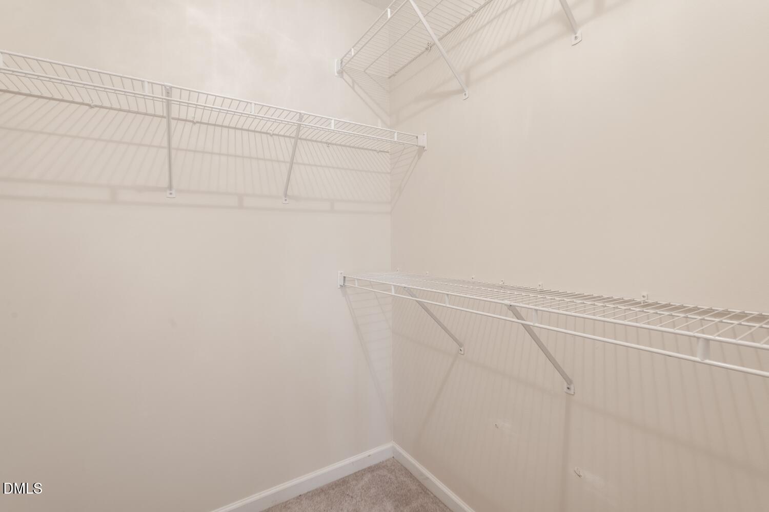 136 Pebblestone Court Willow Spring, NC 27592 - Photo 22 of 24 a view of a room with racks on the wall