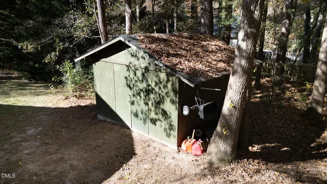 a view of backyard with deck and wooden floor