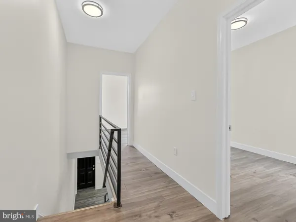 a view of entryway with wooden floor