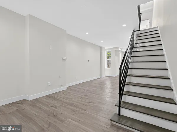 a view of entryway with wooden floor