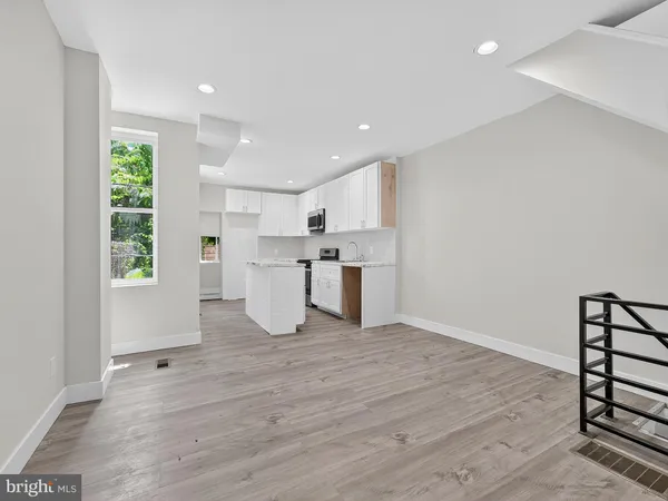 a view of kitchen with wooden floor
