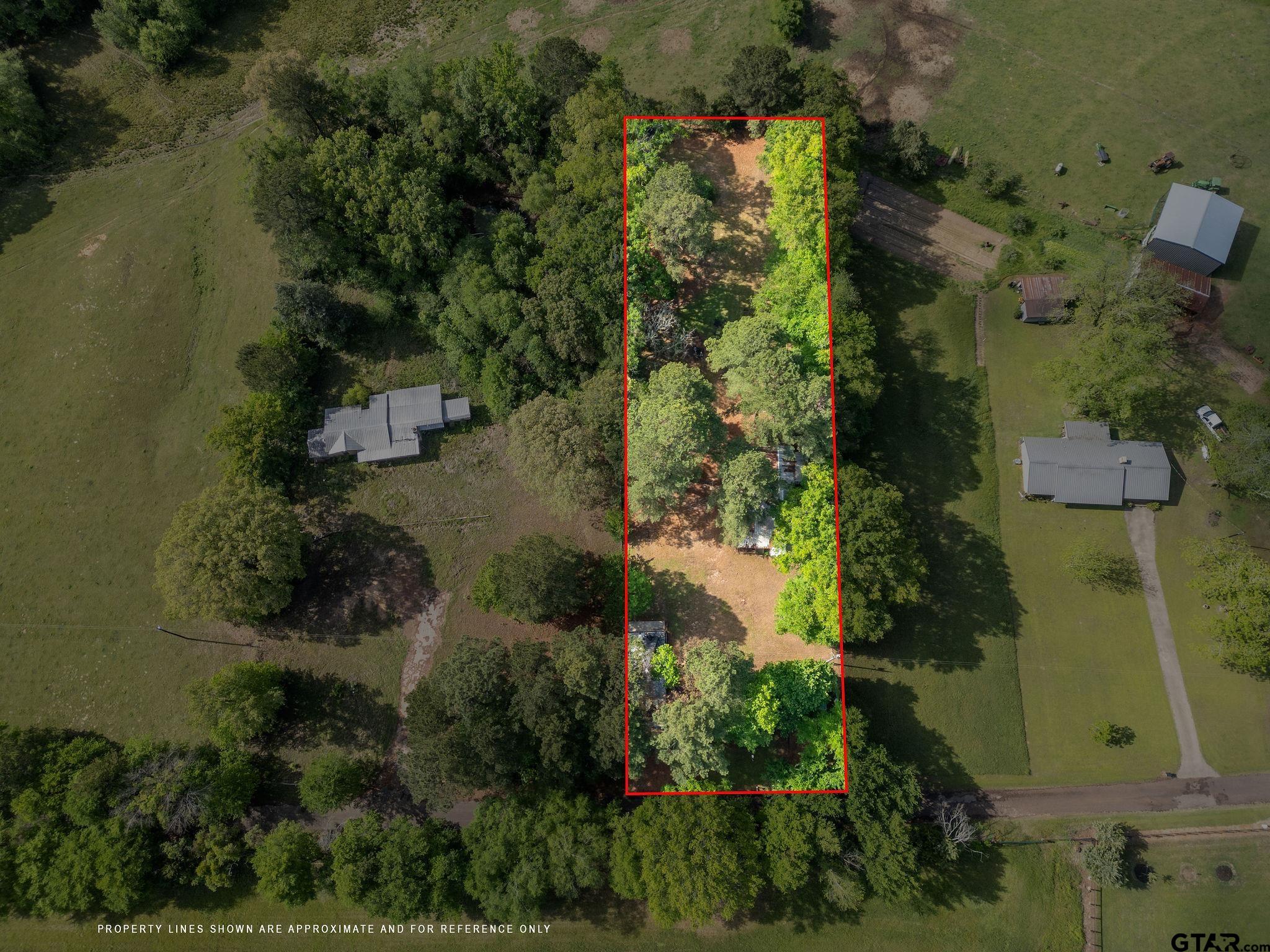 4550 Crabapple Road Gilmer, TX 75645 - Photo 24 of 33 an aerial view of a residential houses with outdoor space and trees