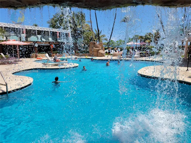 a view of a house with backyard porch and sitting area