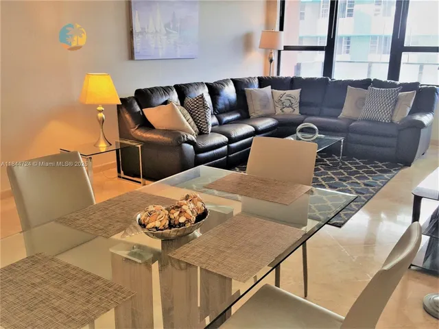 a balcony with furniture and a lamp