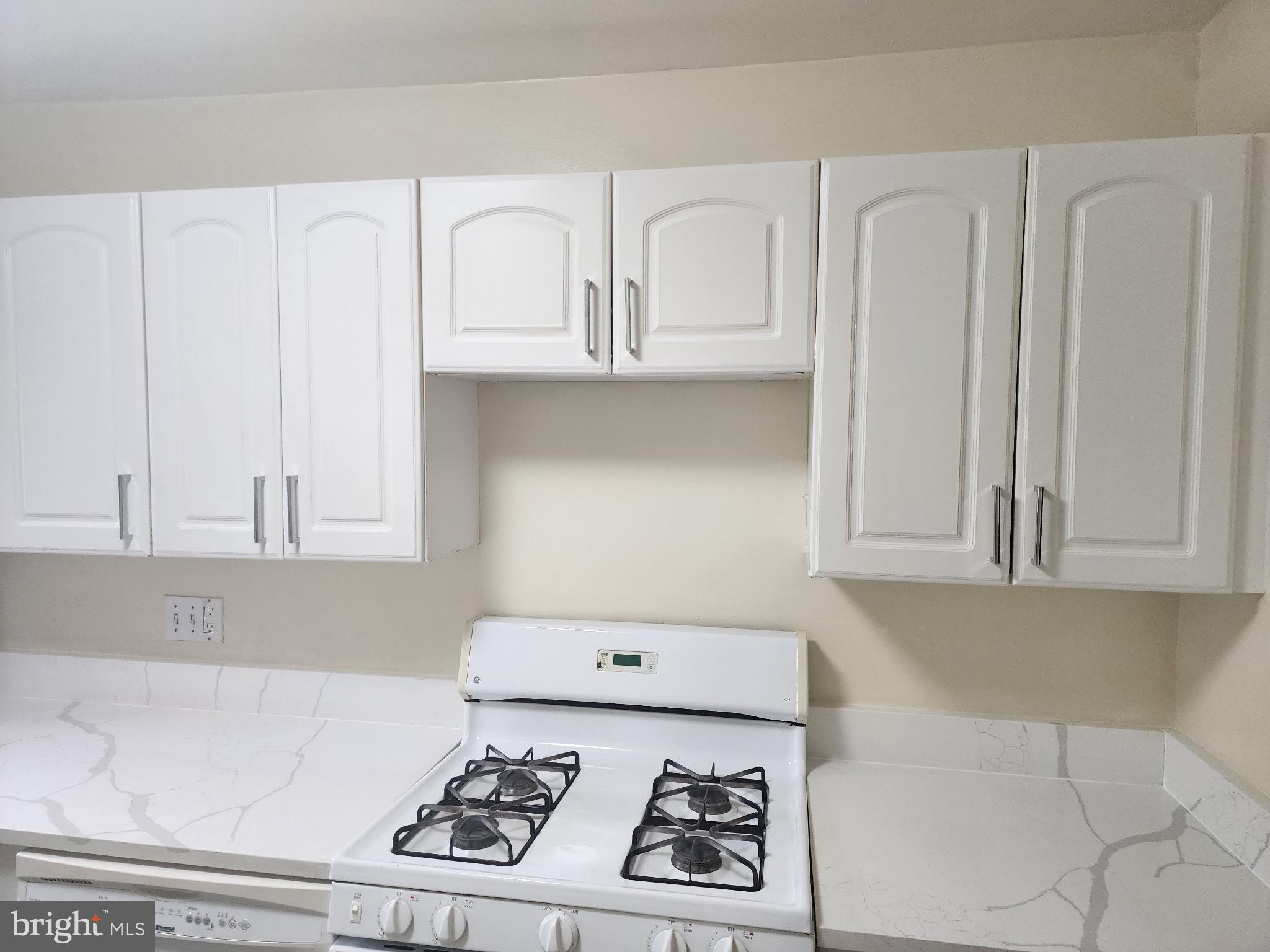 11316 Cherry Hill Road, Unit 203 Beltsville, MD 20705 - Photo 16 of 16 a kitchen with white cabinets and appliances