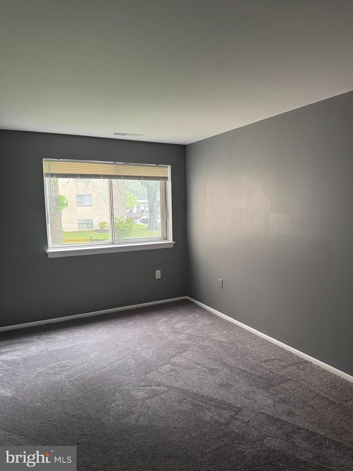 11316 Cherry Hill Road, Unit 203 Beltsville, MD 20705 - Photo 2 of 16 an empty room with a window