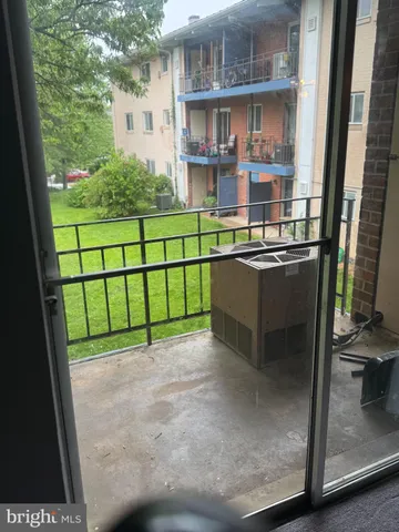 a view of a street with a building in the background