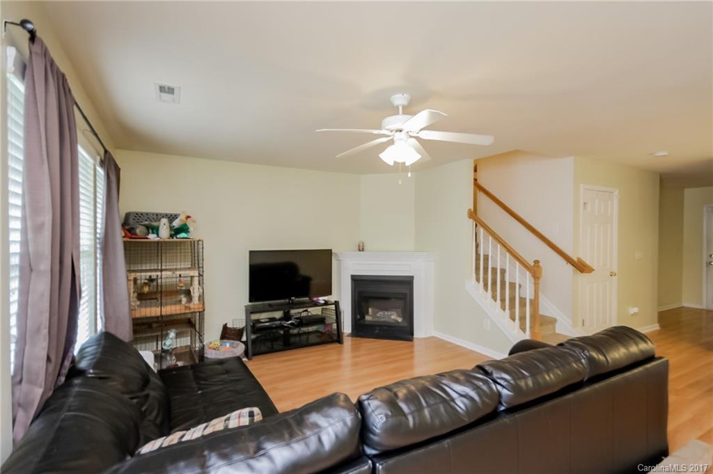 150 Limerick Road, Unit C Mooresville, NC 28115 - Photo 5 of 17 a living room with furniture and a flat screen tv