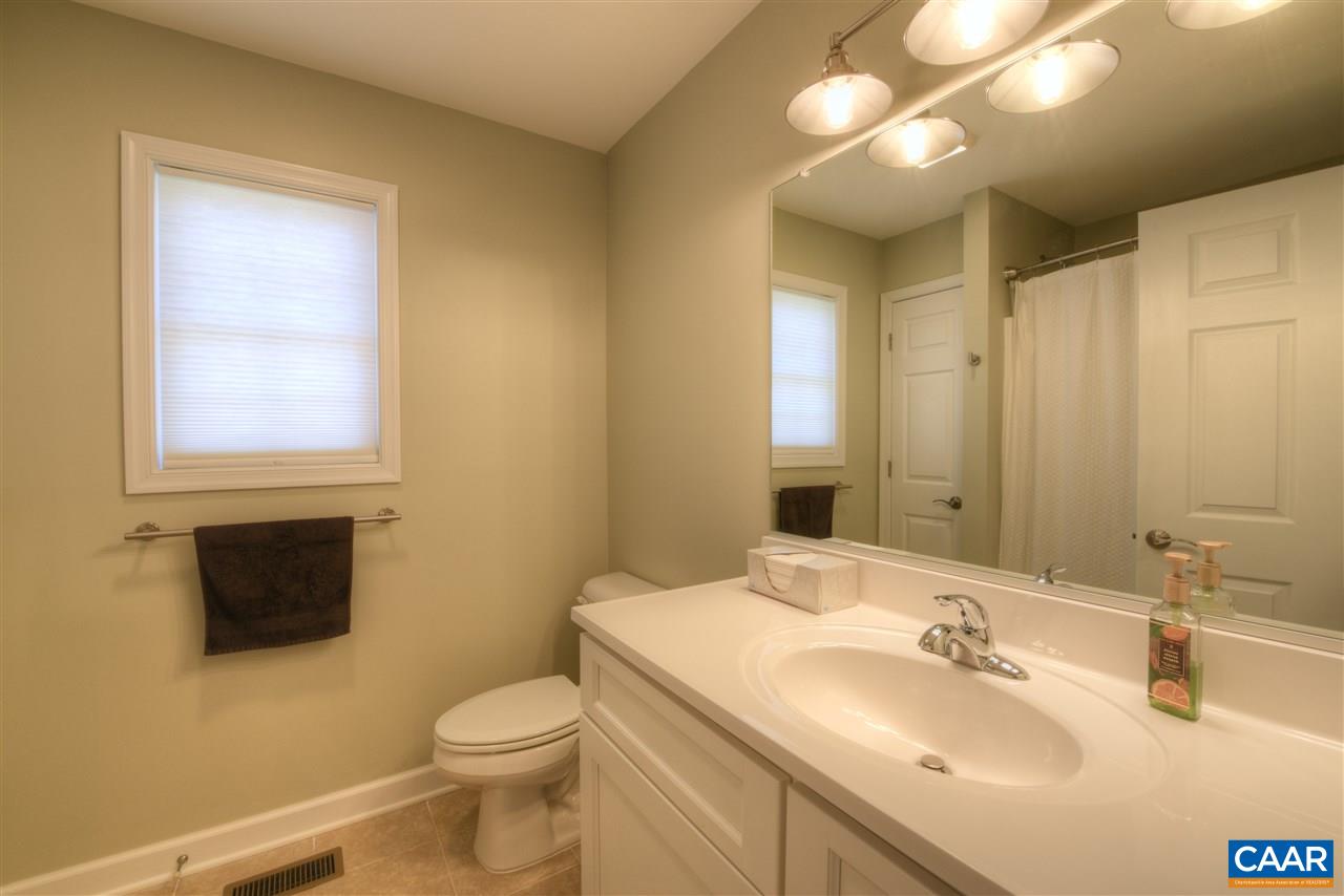 9 Buck Island Road Palmyra, VA 22963 - Photo 15 of 28 a bathroom with a toilet sink and mirror