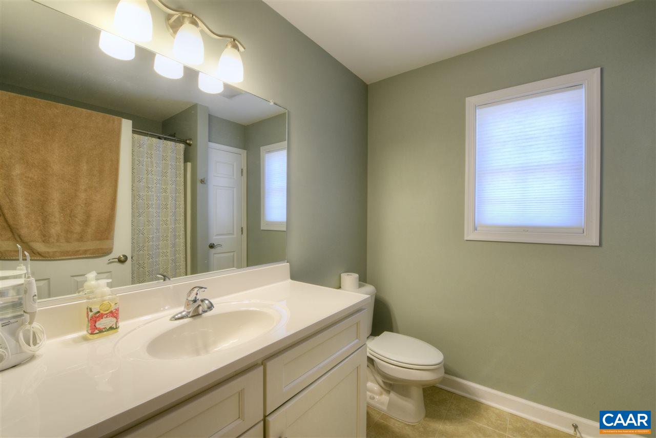 9 Buck Island Road Palmyra, VA 22963 - Photo 18 of 28 a bathroom with a toilet sink and mirror