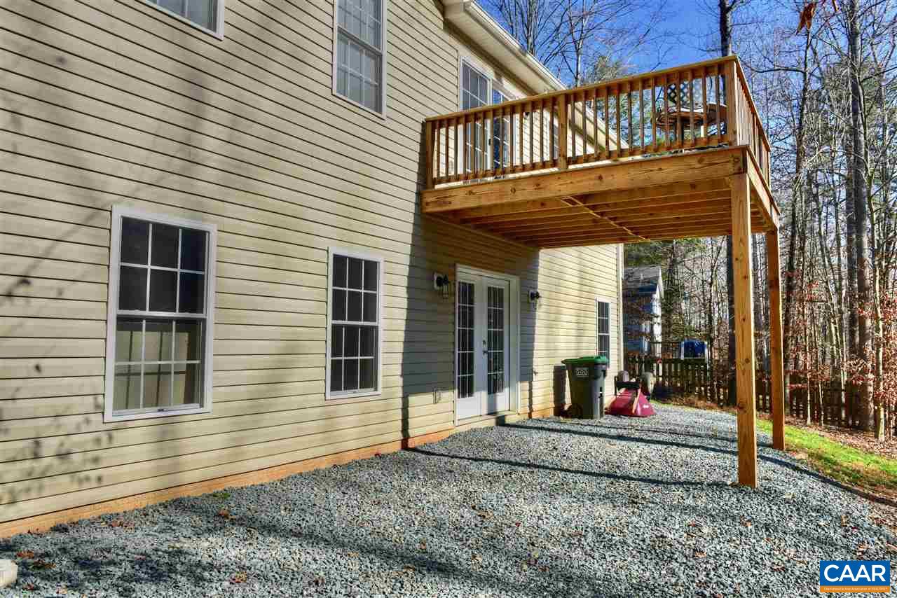 9 Buck Island Road Palmyra, VA 22963 - Photo 24 of 28 a view of a house with a small deck and a floor to ceiling window