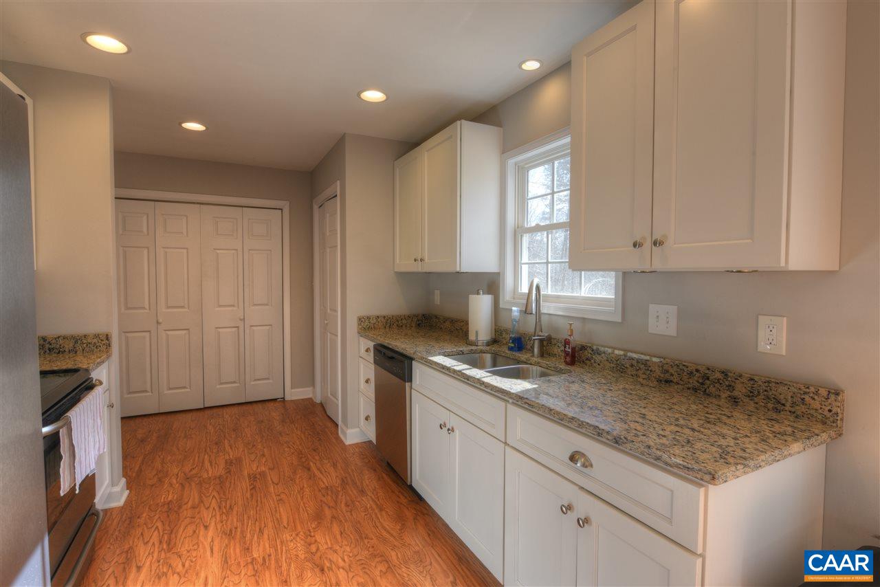 9 Buck Island Road Palmyra, VA 22963 - Photo 6 of 28 a kitchen with a sink window and cabinets