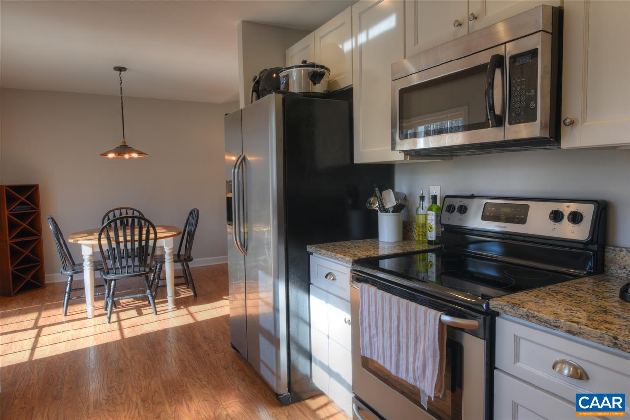9 Buck Island Road Palmyra, VA 22963 - Photo 8 of 28 a kitchen with granite countertop a stove and chairs