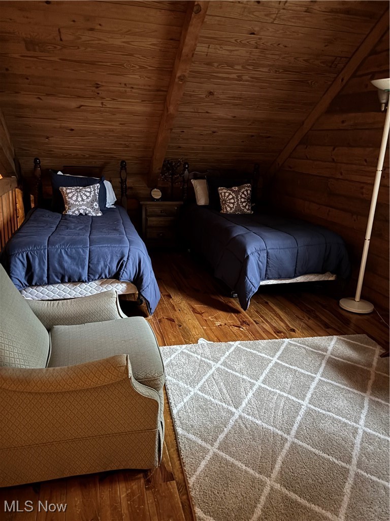 55249 Jim Ball Road Senecaville, OH 43780 - Photo 12 of 14 Bedroom with hardwood / wood-style flooring, wood ceiling, and wooden walls