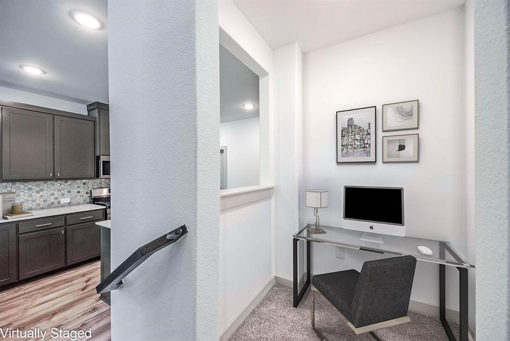 692 Vista Oak Road Lewisville, TX 75067 - Photo 16 of 39 a view of a livingroom with a flat screen tv