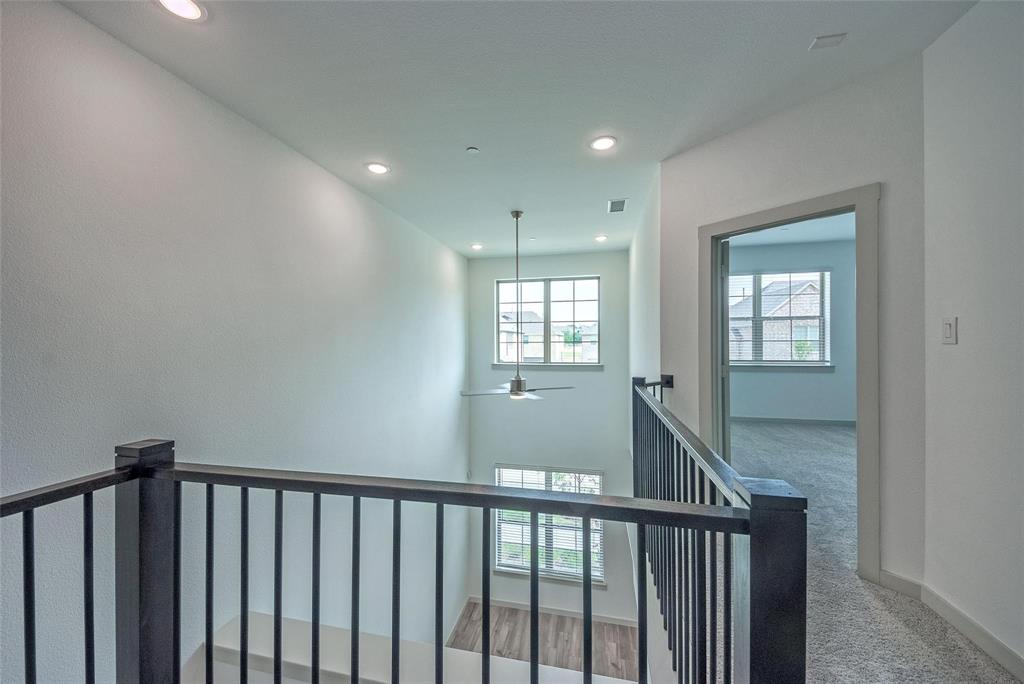 692 Vista Oak Road Lewisville, TX 75067 - Photo 18 of 39 a view of a hallway with windows
