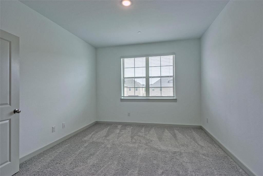 692 Vista Oak Road Lewisville, TX 75067 - Photo 19 of 39 an empty room with a window