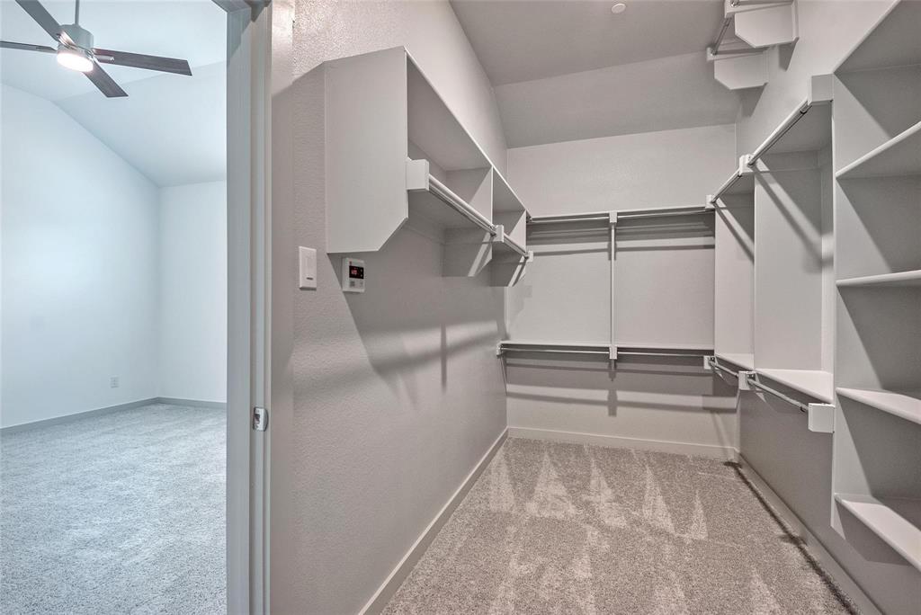 692 Vista Oak Road Lewisville, TX 75067 - Photo 27 of 39 a view of walk in closet with empty racks