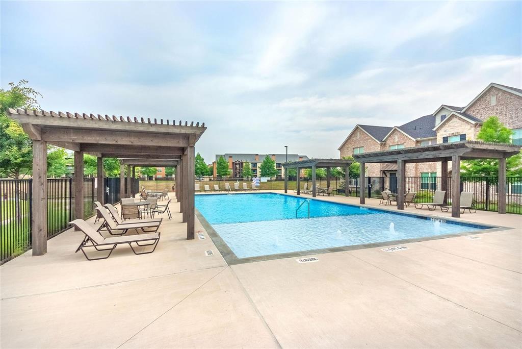 692 Vista Oak Road Lewisville, TX 75067 - Photo 30 of 39 swimming pool view with a garden space