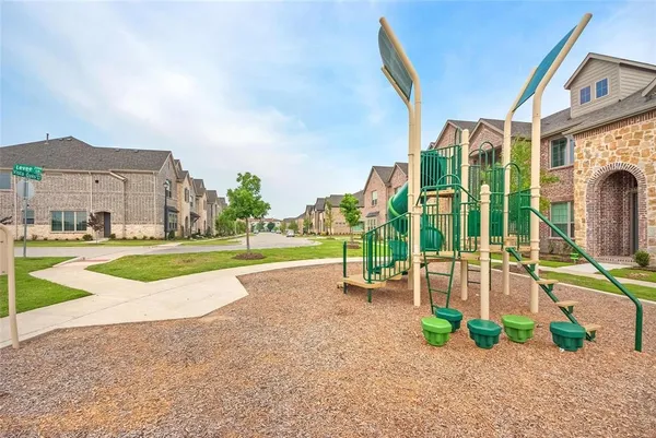 a view of a house with a swimming pool and a big yard