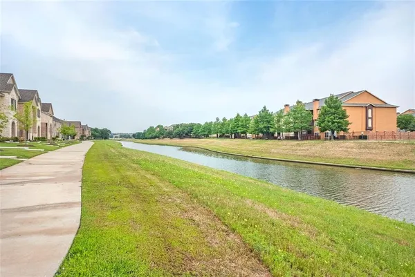 a view of a lake with a big yard
