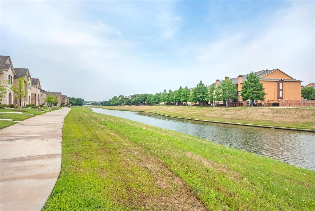 692 Vista Oak Road Lewisville, TX 75067 - Photo 35 of 39 a view of a lake with a big yard