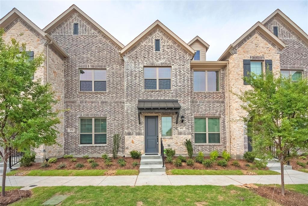 692 Vista Oak Road Lewisville, TX 75067 - Photo 38 of 39 a front view of a house with a yard and large tree