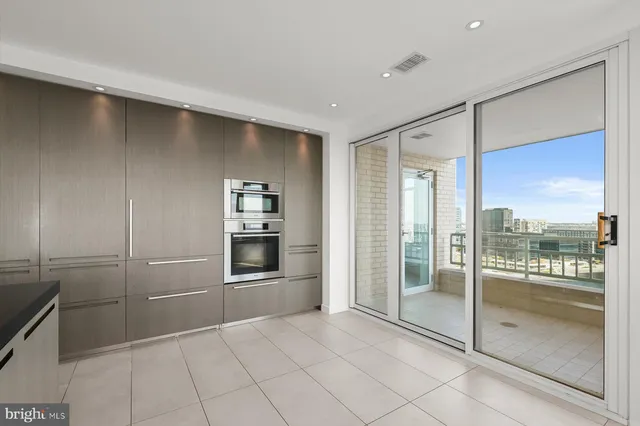 a view of workspace with wooden floor windows